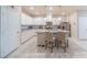 Bright kitchen with white cabinets, granite counters, and stainless-steel appliances at , Henderson, NV 89044