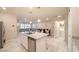 Kitchen island with granite countertops, dishwasher and open view to living area at , Henderson, NV 89044
