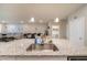 Open concept kitchen island with stainless steel sink overlooking the living area at , Henderson, NV 89044