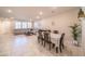 Spacious living area featuring tile flooring, a sectional sofa, and a dining table at , Henderson, NV 89044