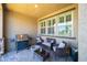 Relaxing outdoor patio with a grill, comfortable seating, and charming decor at , Henderson, NV 89044