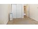 Bedroom with neutral wall color, carpet, closet, and an open door at 10348 Cherry Brook St, Las Vegas, NV 89183
