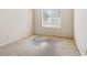 Bedroom with a window, neutral wall color, and wall-to-wall carpet at 10348 Cherry Brook St, Las Vegas, NV 89183