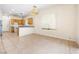 Open-concept kitchen features tile flooring, a breakfast bar, and ample cabinet space at 10348 Cherry Brook St, Las Vegas, NV 89183