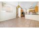 View of the open-concept living space, showcasing the kitchen, dining area, and staircase at 10348 Cherry Brook St, Las Vegas, NV 89183