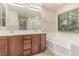 Bathroom boasting double sinks, a soaking tub, and a separate shower at 10584 Peach Creek St, Las Vegas, NV 89179