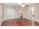 The spacious bedroom features hardwood floors and closet with doors at 10584 Peach Creek St, Las Vegas, NV 89179