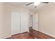 The bright bedroom features hardwood floors and closet with doors at 10584 Peach Creek St, Las Vegas, NV 89179