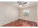 Cozy bedroom features hardwood floors, neutral walls, and a ceiling fan for added comfort at 10584 Peach Creek St, Las Vegas, NV 89179
