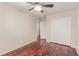 Bedroom with hardwood floors, closet with sliding doors, neutral colors and an adjacent doorway at 10584 Peach Creek St, Las Vegas, NV 89179