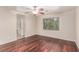 A well-lit bedroom with wood floors, offering a serene and inviting space at 10584 Peach Creek St, Las Vegas, NV 89179