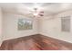 This bedroom features beautiful wood floors and a ceiling fan at 10584 Peach Creek St, Las Vegas, NV 89179