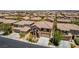 Beautiful two-story home with stone accents, desert landscaping, and an attached two-car garage at 10584 Peach Creek St, Las Vegas, NV 89179