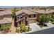 Charming home with desert landscaping, stone accents, a tile roof, and a two-car garage at 10584 Peach Creek St, Las Vegas, NV 89179
