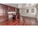 Well-lit home office featuring hardwood floors, custom cabinets, and built-in shelving at 10584 Peach Creek St, Las Vegas, NV 89179