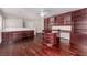 Spacious home office with custom built-ins, hardwood floors, and ample natural light at 10584 Peach Creek St, Las Vegas, NV 89179
