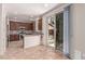 Modern kitchen features granite countertops, stainless steel appliances, and a sliding glass door to the backyard at 10584 Peach Creek St, Las Vegas, NV 89179