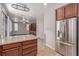 Open concept kitchen showcasing stainless steel appliances, granite countertops and views of the living area at 10584 Peach Creek St, Las Vegas, NV 89179