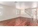 Spacious living room featuring hardwood floors, a decorative chandelier, and a staircase to the second floor at 10584 Peach Creek St, Las Vegas, NV 89179