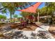 Community playground area with modern play structure, shade sail and attractive landscaping at 10584 Peach Creek St, Las Vegas, NV 89179