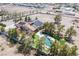 Aerial view of property with a pool, solar panels, and mature trees at 1106 E Athens Ave, Henderson, NV 89015