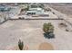 View showcasing the vast lot, single tree, and minimalist desert landscaping at 1106 E Athens Ave, Henderson, NV 89015