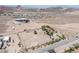 Scenic aerial view of the property's layout, landscaping, and expansive surroundings at 1106 E Athens Ave, Henderson, NV 89015