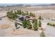 A high angle view emphasizing the home, native desert vegetation, and solar panels at 1106 E Athens Ave, Henderson, NV 89015
