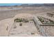 Expansive property with a home and surrounding natural landscape, as seen from above at 1106 E Athens Ave, Henderson, NV 89015
