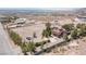 Aerial view displaying the home's lot, mature trees, and desert landscaping at 1106 E Athens Ave, Henderson, NV 89015