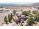 Aerial view revealing home's architecture, solar panels, and tranquil desert setting at 1106 E Athens Ave, Henderson, NV 89015