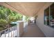 The covered porch faces the side yard at 1106 E Athens Ave, Henderson, NV 89015