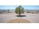 Large vacant lot with desert landscaping and mountain views in the distance at 1106 E Athens Ave, Henderson, NV 89015
