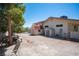 Exterior backyard featuring sheds and mature trees, offering privacy and ample space at 1106 E Athens Ave, Henderson, NV 89015