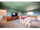 Open layout of the bedroom featuring carpet flooring, wood accents, and a cozy atmosphere at 1106 E Athens Ave, Henderson, NV 89015