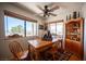 Cozy dining room with wood table, chairs, and a ceiling fan at 1106 E Athens Ave, Henderson, NV 89015