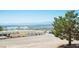 A building under construction with an expansive view of the distant cityscape and mountain range at 1106 E Athens Ave, Henderson, NV 89015