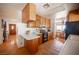 Charming kitchen featuring wood cabinets, tiled floors, modern appliances, and natural light at 1106 E Athens Ave, Henderson, NV 89015