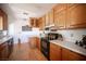 Functional kitchen featuring ample cabinet space, white countertops, and modern appliances at 1106 E Athens Ave, Henderson, NV 89015