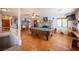 Expansive living area showcasing the pool table, fireplace, and open layout for entertaining at 1106 E Athens Ave, Henderson, NV 89015