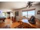 Open-plan living room with large windows and a unique decorative table at 1106 E Athens Ave, Henderson, NV 89015