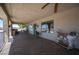 Covered patio with beautiful stonework and a view of the desert landscape at 1106 E Athens Ave, Henderson, NV 89015