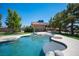 Backyard swimming pool with stone accents and mature trees at 1106 E Athens Ave, Henderson, NV 89015