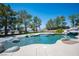 Gorgeous pool with rock features and lush landscaping, perfect for relaxation and entertaining at 1106 E Athens Ave, Henderson, NV 89015