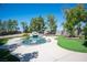 Beautiful pool, water feature, and landscaped backyard with desert landscaping and artificial grass at 1106 E Athens Ave, Henderson, NV 89015