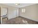 This bedroom features a sliding door closet, neutral paint, one window, and carpet flooring at 1804 David Ave, Las Vegas, NV 89101