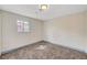 A basic bedroom with carpeted floors and a single window provides simple comfort at 1804 David Ave, Las Vegas, NV 89101
