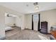 A spacious bedroom with carpet flooring, window with curtains, and additional room at 1804 David Ave, Las Vegas, NV 89101
