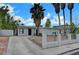 Single-story home with desert landscaping, a driveway and block fence at 1804 David Ave, Las Vegas, NV 89101