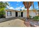 Cozy single-story home showcasing a front patio, desert landscaping, and modern black doors at 1804 David Ave, Las Vegas, NV 89101